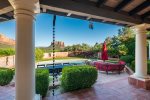 To the meticulously landscaped 1.5 acre gardens